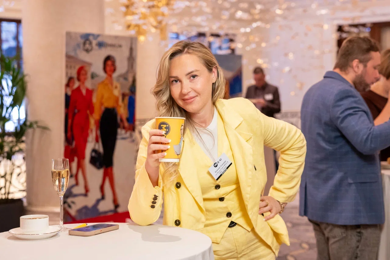 A MICE4U delegate with a branded coffee cup at The Carlton in Moscow